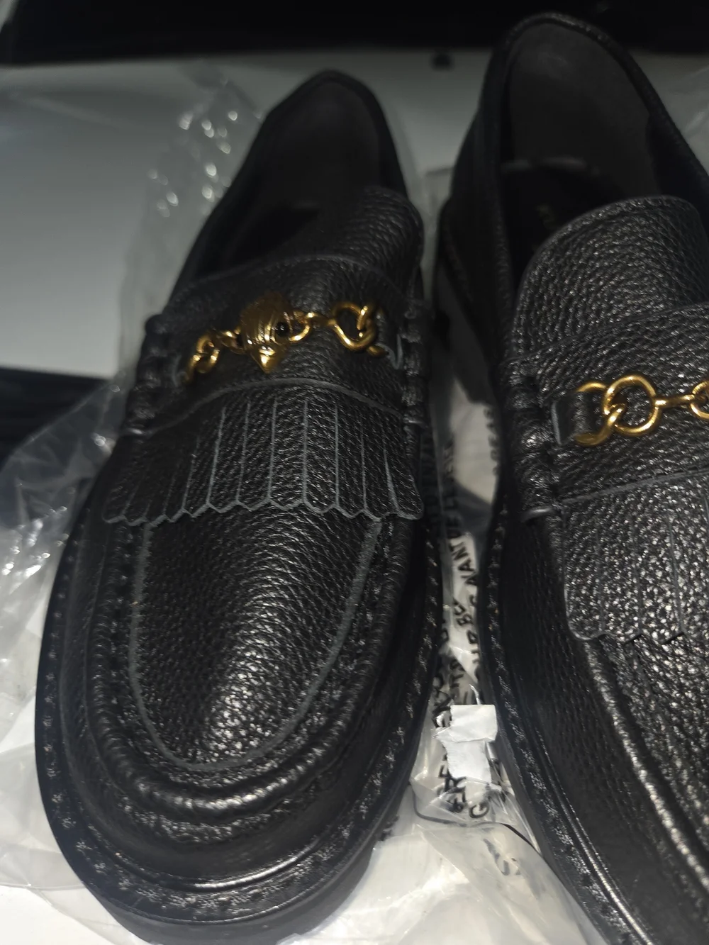 Kurt Geiger Black Pebbled Leather Kiltie Loafers with Gold Chain